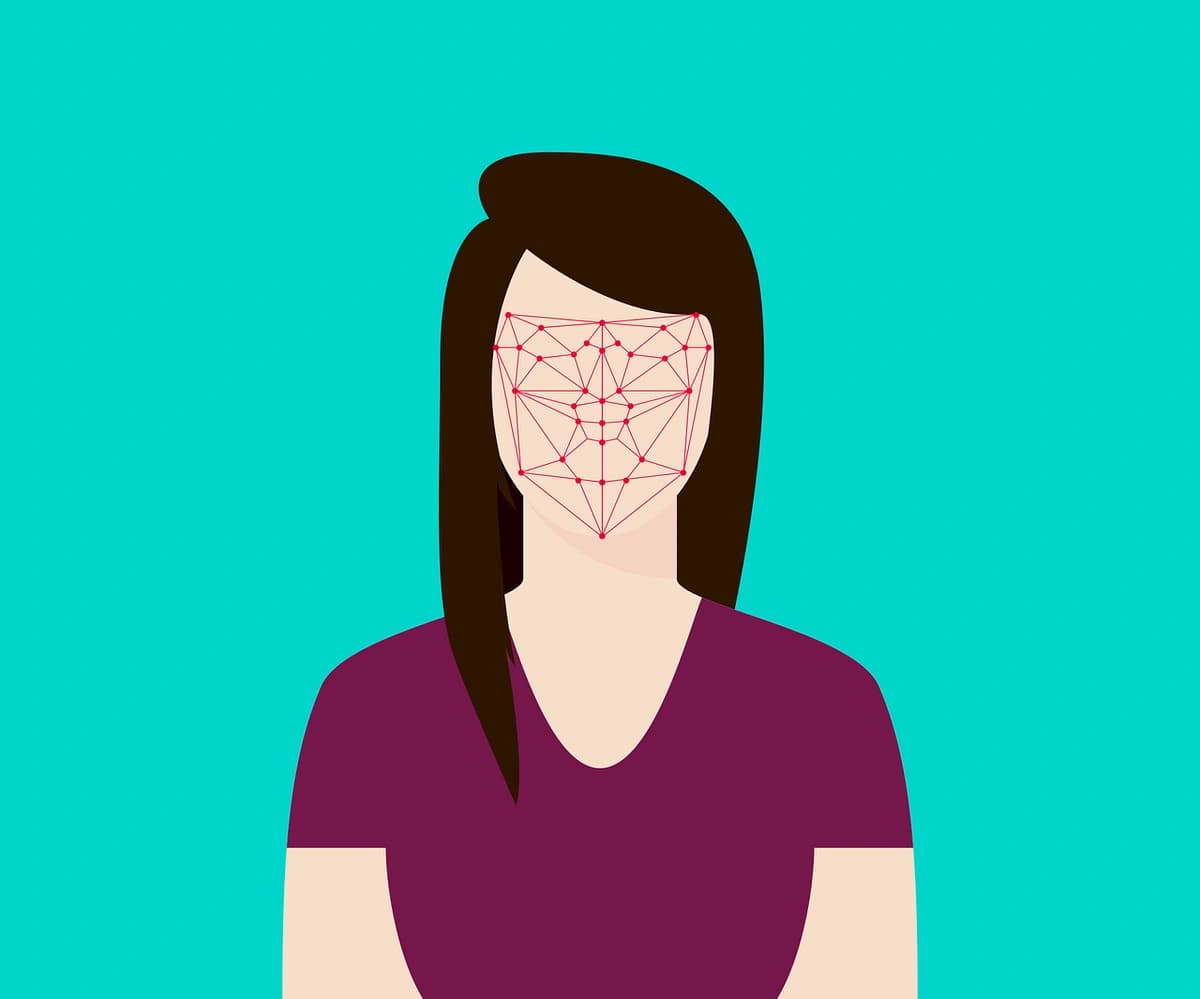 A person's face being scanned for facial recognition, illustrating the concept of biometric authentication